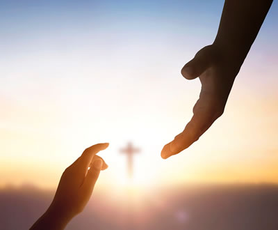 Hands reaching toward each other