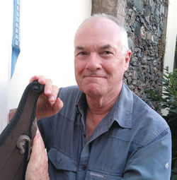 Fr. John Boles beside the "oar-less coracle"