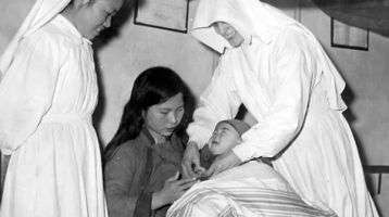 Two Sisters helping a mother with her baby in China
