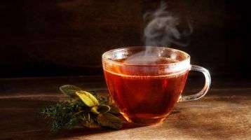 Steaming cup of tea on a table