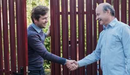 two people in a friendly handshake
