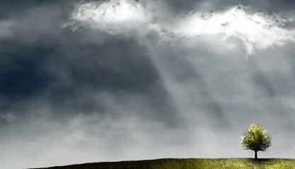 sun shines through stormy clouds
