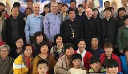 Columban Fr. Dan Troy, Fr. Thomas Greisen and Omaha Archbishop George Lucas with the bishop of Zhoucun Diocese.