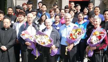 Omaha, Neb., Archbishop George Lucas (first row, center) is welcomed to China by Chinese church at South Cathedral in Beijing.