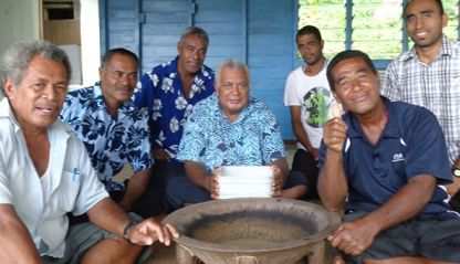 A group of Fijian men sitting around the yaqona bowl