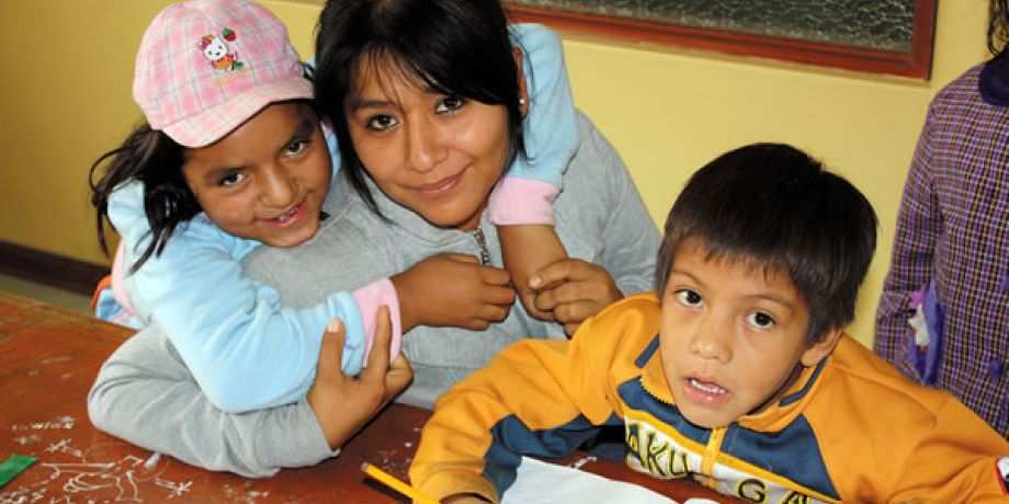 A volunteer works with children and the center