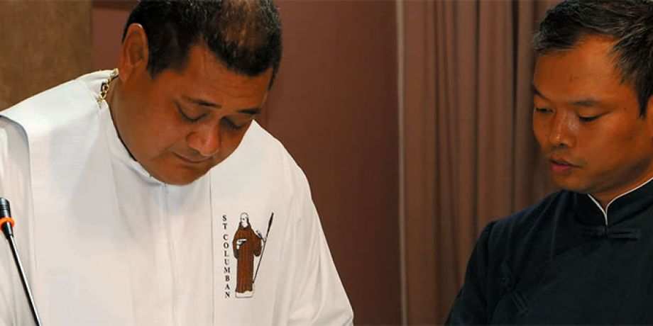 Columban Fr. Felisiano Fatu signs Peter's Society membership form.