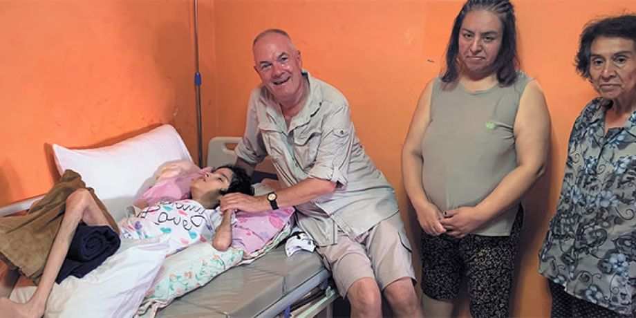 Fr. John Boles with Andrea and her family
