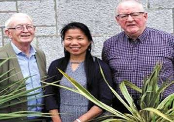 Angie with Fr. Berne Steed (left) and Fr. Oli McCrossan (right)