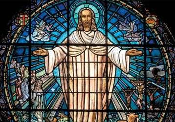 Stained glass window of risen Jesus