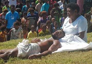 Actors portray Jesus in the arms of his mother.