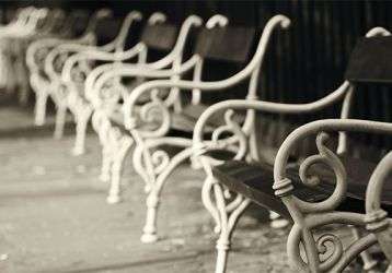 Empty chairs lined up outdoors